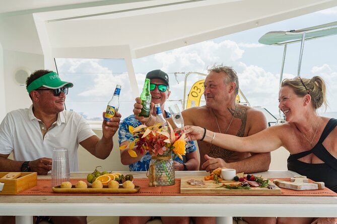 Be Happy - Private Catamaran Cruise Sint Maarten Full Day Tour - Onboard setup: floating mat, SUP, fishing gear, and included food