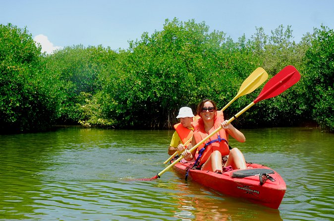Kayak Lagoon Tour - Stop 2: paddling the lagoon—stories, yachts, and the Dutch-French water boundary